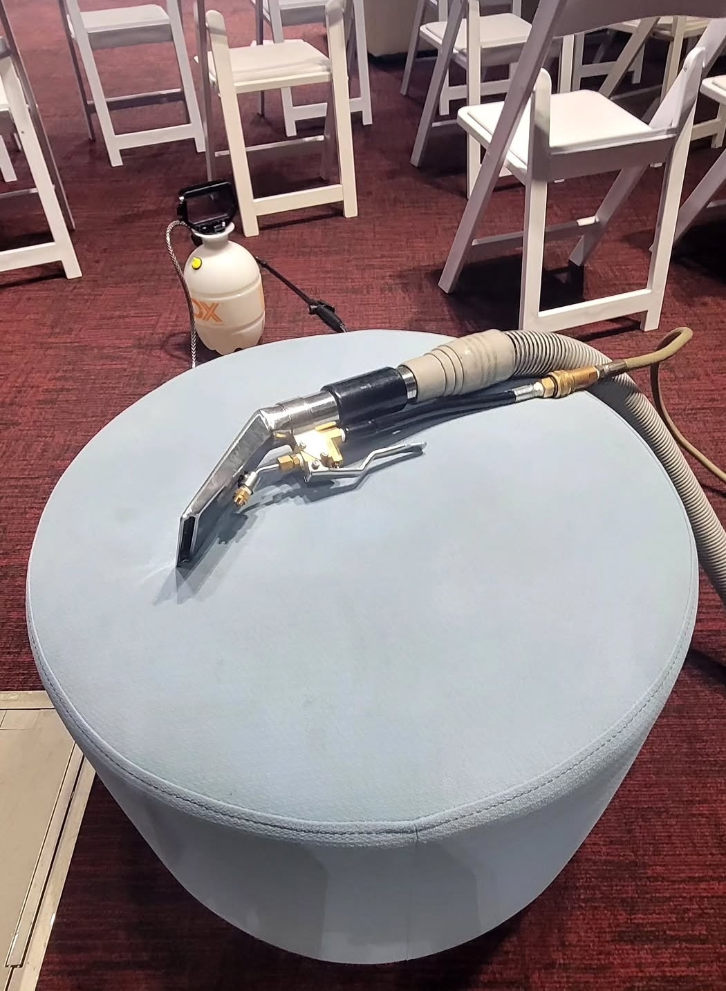 Light blue velvet ottoman being cleaned