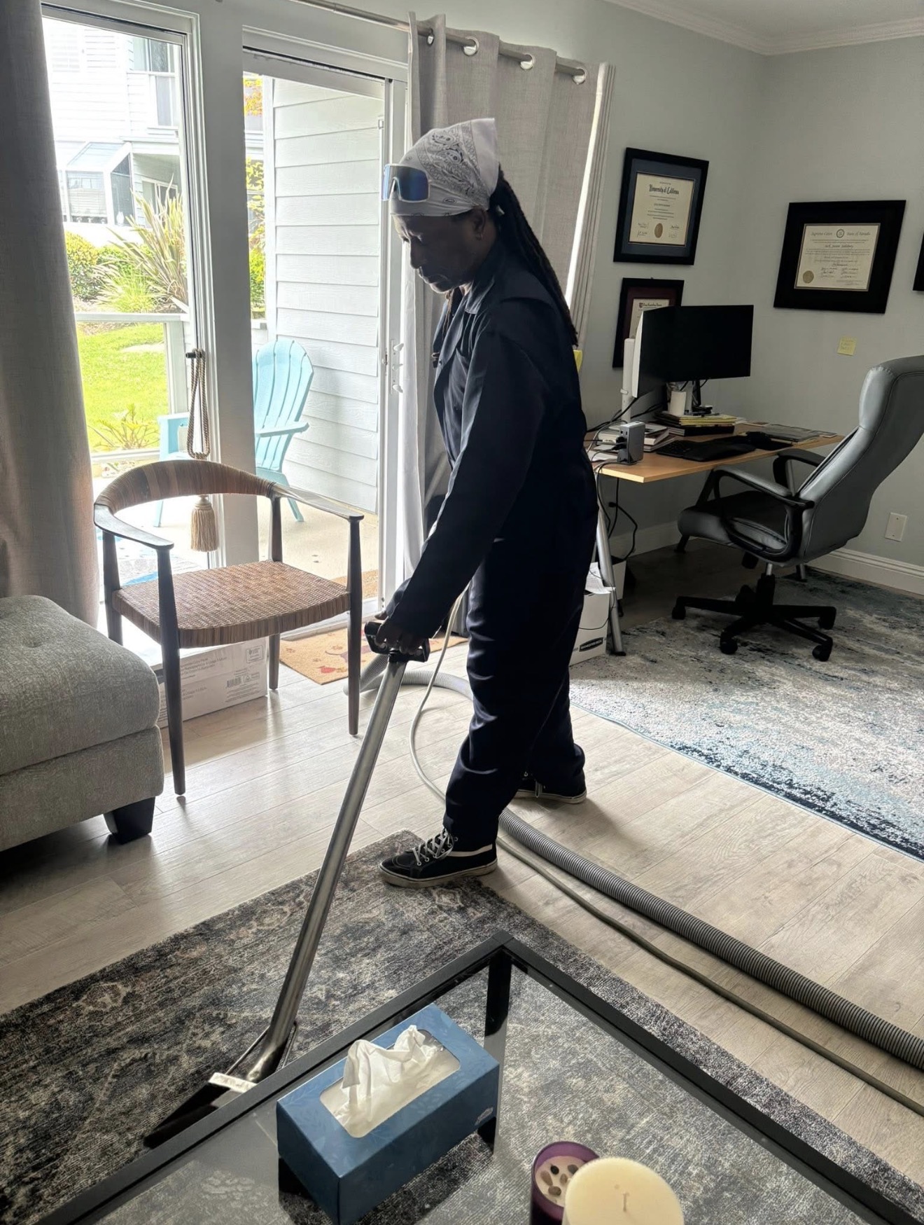 Captain Carpet Cleaner technician cleaning a client's floor